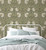 William Morris Pimpernel Peel and Stick Wallpaper by Paperbird Home in vintage sage green and cream, ideal for a maximalist home office or a traditional moody study.