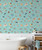 Beach house bathroom with bathtub in front of wallpaper featuring people swimming in water