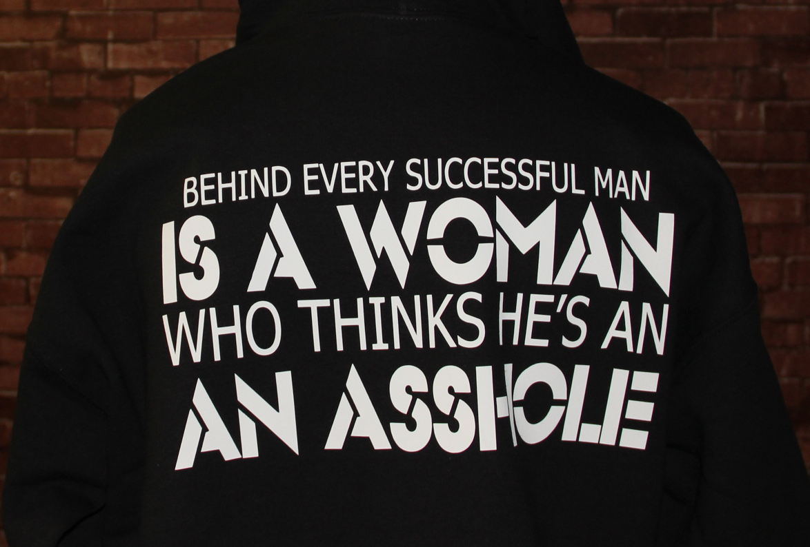 behind-every-sucessful-man-is-a-woman-who-thinks-hes-an-asshole-t-shirts.jpg