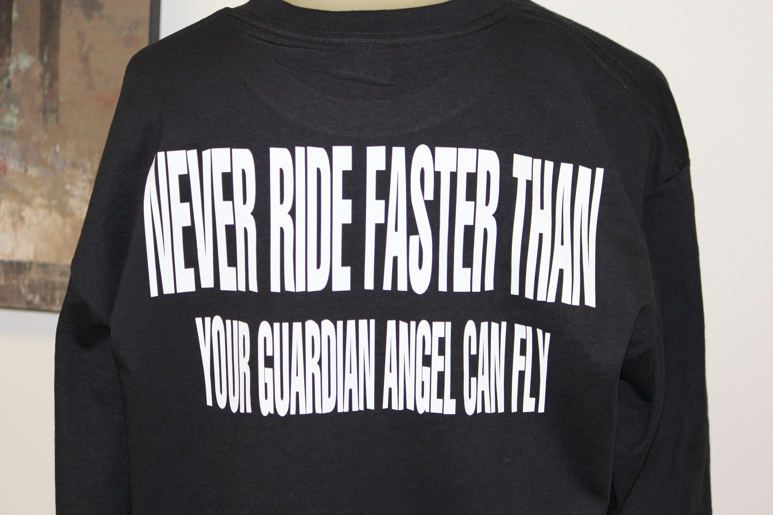 never-ride-faster-than-your-guardian-angel-can-fly-biker-t-shirts.jpg