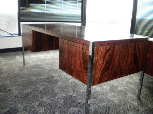 Outstanding Mid-Century Knoll Executive Desk by Richard Schultz in Rare Rosewood.
Designed for Knoll in 1963 and this desk was manufactured in 1982.
This is a rare rosewood version of this classic desk that Richard Schultz designed for Knoll. The wood grain is amazing. It is a large, 6 foot desk with plenty of surface space and leg room. The polished chrome trim and inlaid accent strips contrast beautifully with the rosewood. It is well built and sturdy.

Measurements
height: 29 in.
depth: 32 in.
width/length: 6 ft.

Damage to RH drawer and normal wear around the knee-space but other than that in very good condition.

Creator: Richard Schultz for Knoll