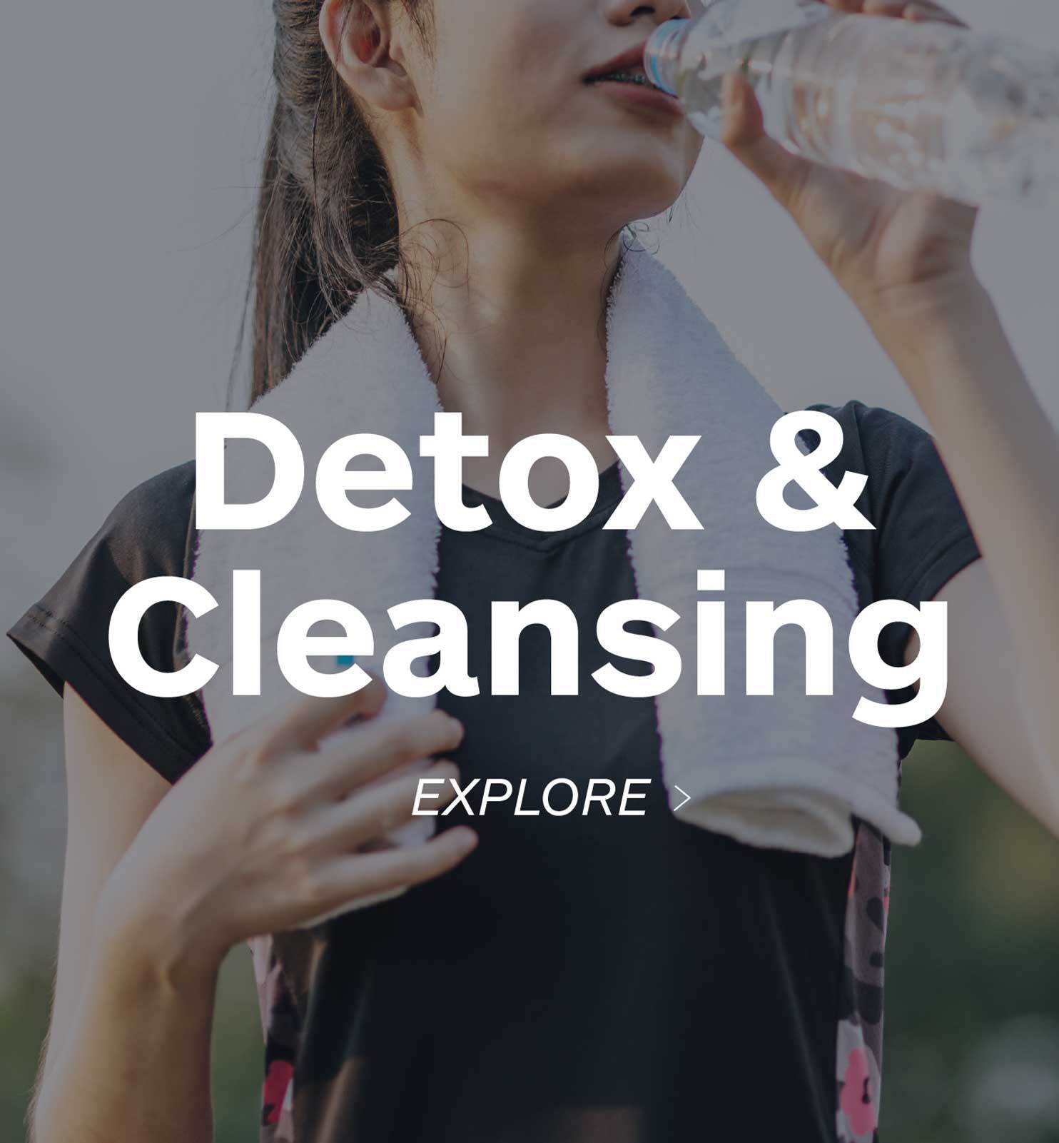 happy woman drinking out of a water bottle