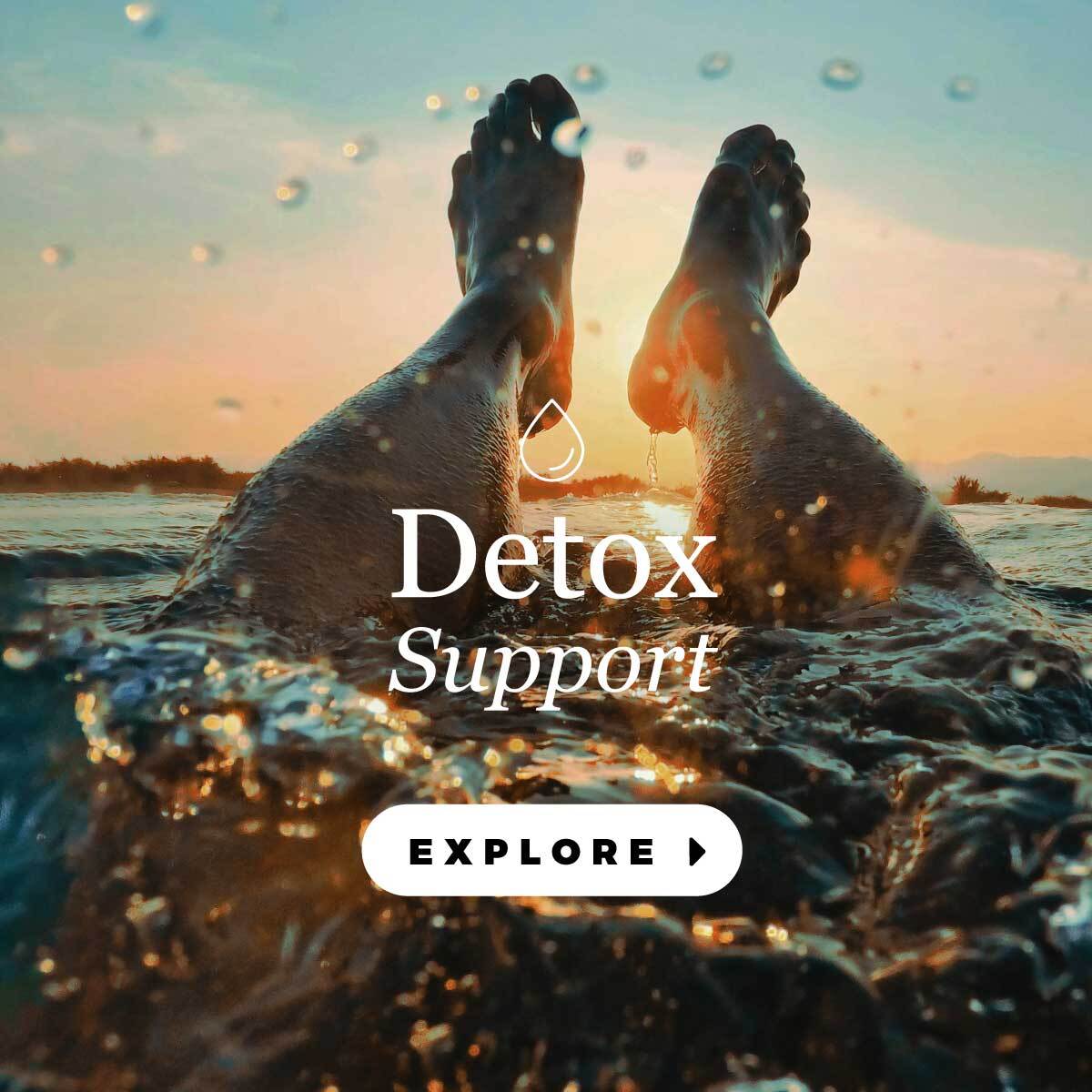 happy woman drinking out of a water bottle