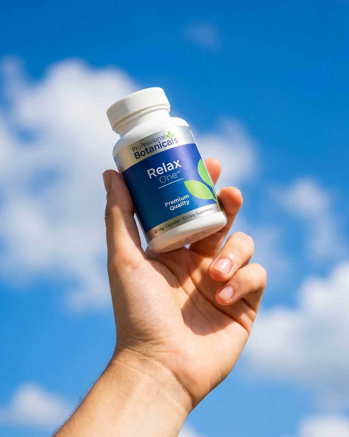 Relax One product held against a blue sky