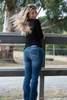 Wearing Bullzye Women's Dahlia Boot Cut Jeans 34"Leg in Blue Wash