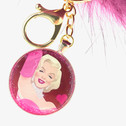 Marilyn Monroe Comic Image Pendant keychain surrounded in pink glitter with an oversized Pom Pom key chain.