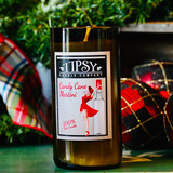 Wine Bottle Candles for the Holidays.  This Soy candle is set in a hand-cut recycled wine bottle and is part of a green initiative dedicated to environmental responsibility, freshness, and quality.  Made by Tipsy Candle Company.
