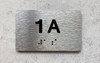 APT NUMBER 1A COMPLIANCE SIGN-UNIT NUMBER COMPLIANCE SIGN WITH RAISED LETTERS