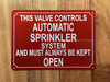 NYC THIS VALVE CONTROLS AUTOMATIC SPRINKLER SYSTEM AND MUST ALWAYS BE KEPT OPEN SIGN