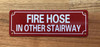 FIRE HOSE IN OTHER STAIRWAY COMPLIANCE SIGN