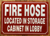 FIRE HOSE LOCATED IN STORAGE CABINET IN LOBBY SAFETY SIGN