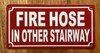 FIRE HOSE IN OTHER STAIRWAY SAFETY SIGN