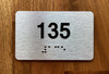 Apartment number 135 Ada Sign