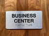 Business Center With Sign with Raised Letters Compliance Sign
