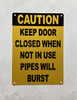 caution-keep-door-closed-when-not-in-use-pipes-will-burst-building-safety-wall-plate.jpg