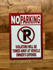 no-parking-violators-will-be-towed-with-symbol-5x7-mounting-holes.jpg