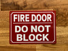 fire-door-do-not-block-sign-7-x-10-inches-mounting-holes.jpg