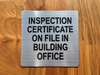 inspection-certificate-on-file-in-building-office-double-sided-tape-sign.jpg
