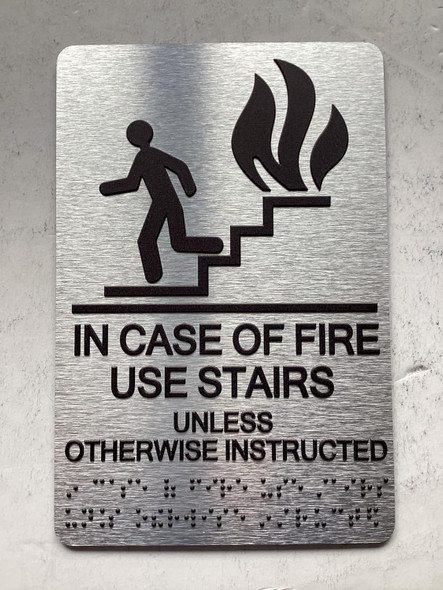 NYC NYC IN CASE OF FIRE USE STAIRS UNLESS OTHERWISE INSTRUCTED SIGN WITH RAISED LETTERS SIGN