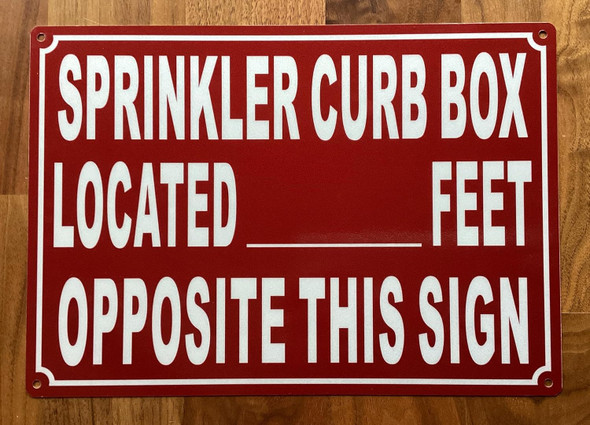 NYC SPRINKLER CURB BOX LOCATED FEET OPPOSITE THIS SIGN SIGN