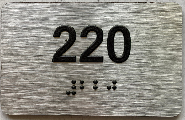 apartment number 220 sign