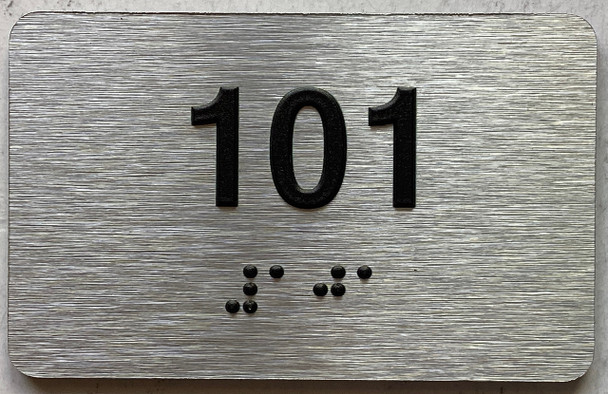 apartment number 102 sign