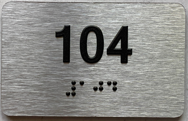 apartment number 104 sign