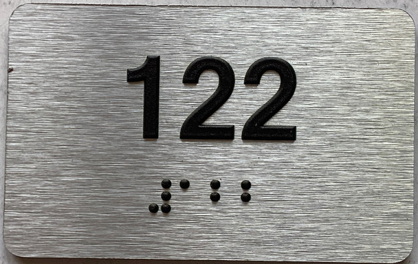 apartment number 122 sign