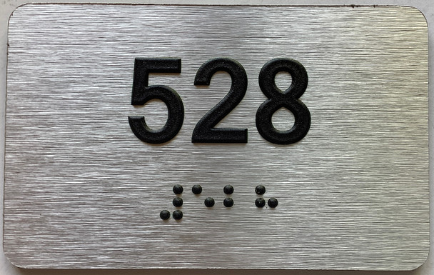 apartment number 528 sign