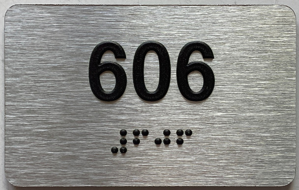 apartment number 606 sign