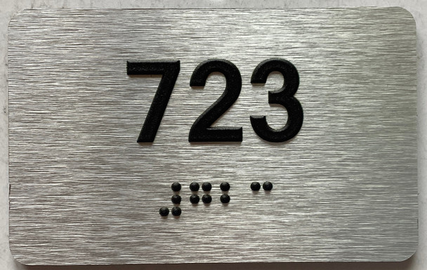 apartment number 723 sign