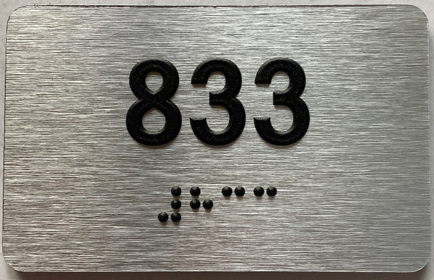 apartment number 833 sign