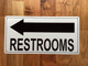 RESTROOM LEFT ARROW COMPLIANCE SIGN