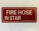 NYC FIRE HOSE IN STAIR BLANK SIGN
