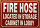 FIRE HOSE LOCATED IN STORAGE CABINET IN LOBBY COMPLIANCE SIGN