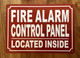FIRE ALARM CONTROL PANEL LOCATED INSIDE COMPLIANCE SIGN