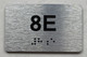 APT# 8E SILVER Braille Sign
