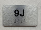 APT# 9J SILVER Ada Sign