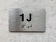APT# 1J Compliance Sign