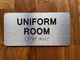 The Uniform Room Compliance Sign