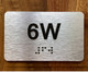 Apartment Number 6W Ada Sign