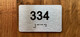 Apartment number 334 Ada Sign