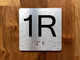 1R Elevator Jamb Plate Compliance Sign
