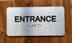 Entrance With Sign with Raised Letters Ada Sign