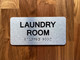Laundry Room With Sign with Raised Letters Compliance Sign
