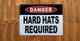 white-danger-hard-hats-requi-screw-mount-sign.jpg