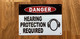 white-danger-hearing-protection-requi-screw-mount-sign.jpg