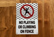 white-no-playing-or-climbing-on-fence-screw-mount-sign.jpg