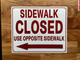 sidewalk-closed-use-pedestrian-walkway-arrow-left-sign-wb-red-as-listed-equipment-notice.jpg