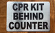 cpr-kit-behing-counter-aluminum-sign-peel-and-stick.jpg